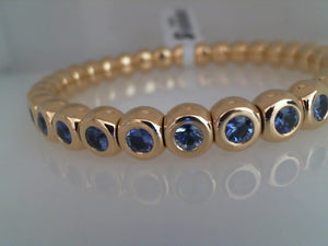 RIU 18k yellow gold bezel set blue sapphire stretch bracelet small