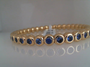 RIU 18k yellow gold bezel set Blue Sapphire stretch bracelet medium